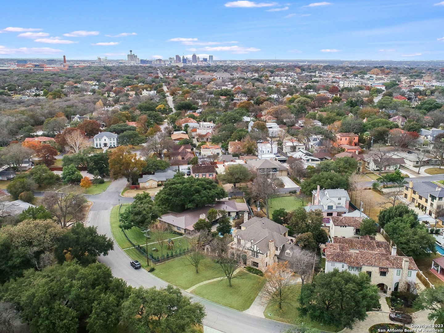 Estate framed by mature oaks in Alamo Heights